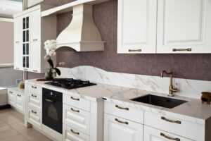 Kitchen with white countertops and cabinets