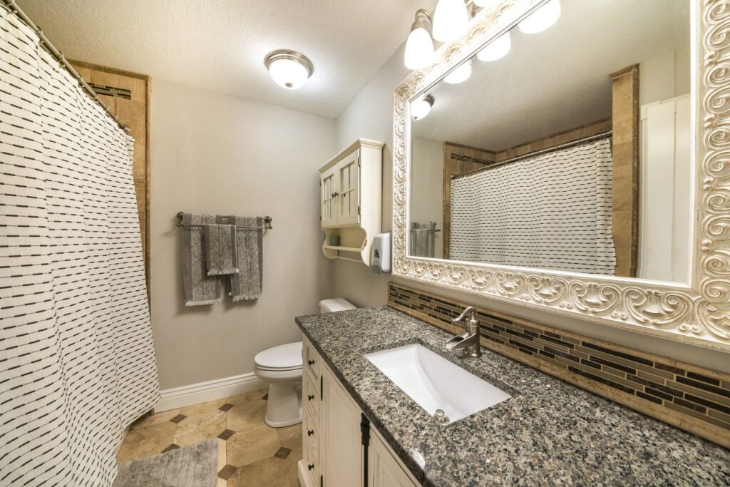 Remodeled bathroom with a spacious countertop and large vanity area