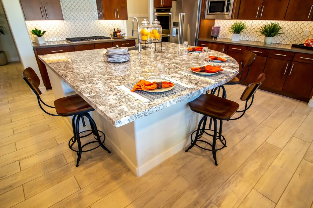 Granite Counter Island With Place Settings In Modern Kitchen